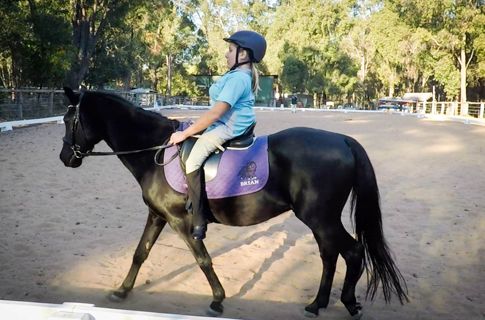 Bek riding pony.