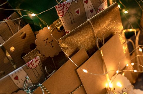 A photo of Xmas presents festooned with fairy lights
