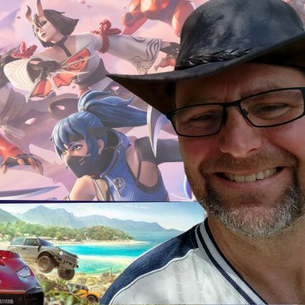 A man in a hat in front of a collage of stills from video games