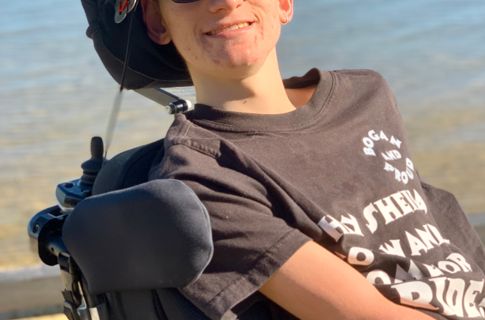 Joey smiling at the beach.