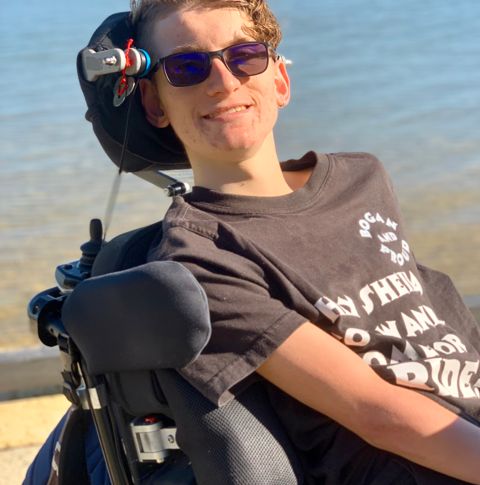 Joey smiling at the beach.