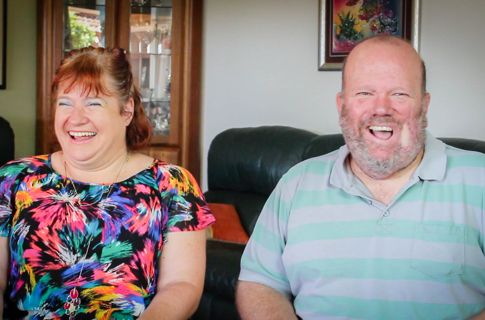 Kerrie and Martin in living room smiling.