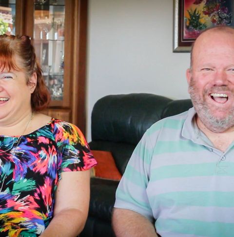 Kerrie and Martin in living room smiling.