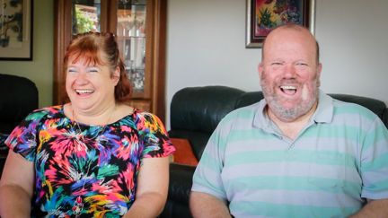Kerrie and Martin in living room smiling.