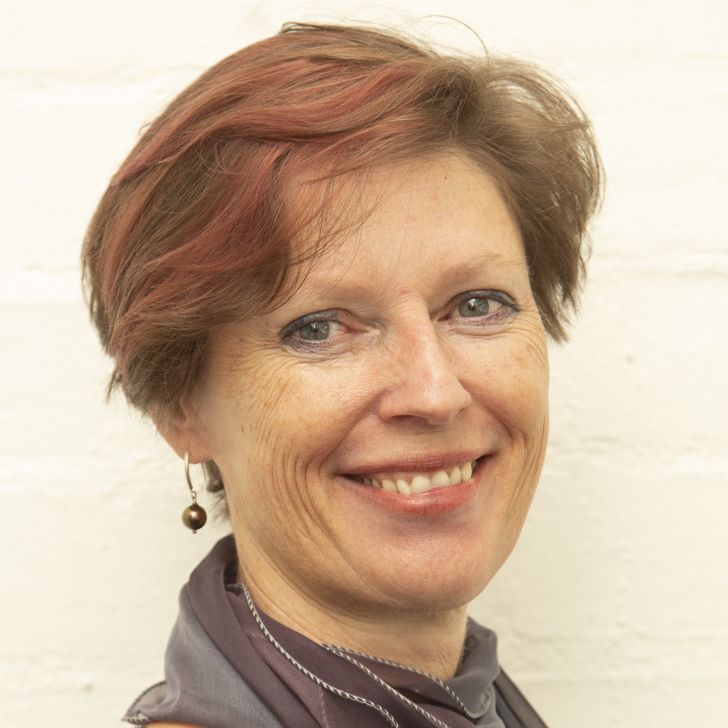 Photo of a smiling woman with short hair