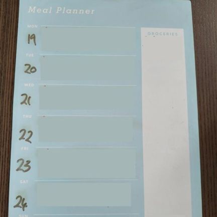 Photo of a meal planner with the details blurred
