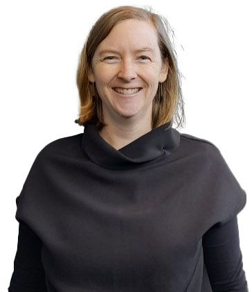 A photo of a smiling woman in a soft, black top