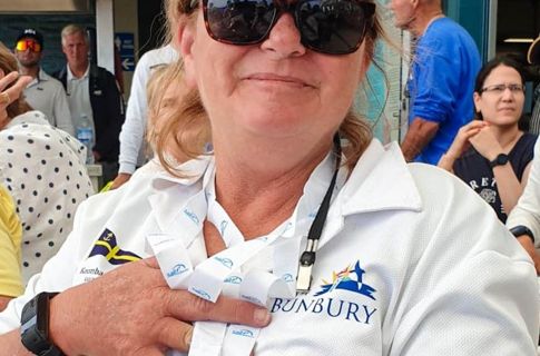 Tracey with the medal and dark sunnies.