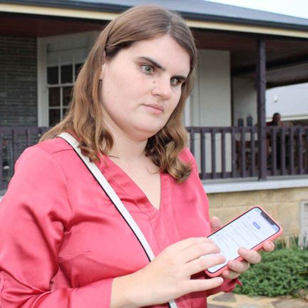 Woman-using-her-mobile-phone