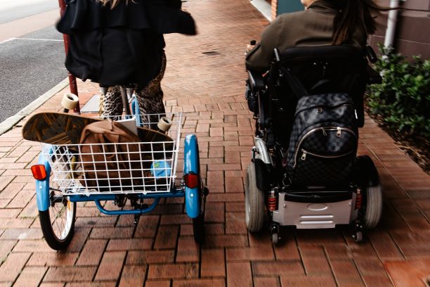 DSC_4128_two A woman in a wheelchair and a woman on a trike ride away