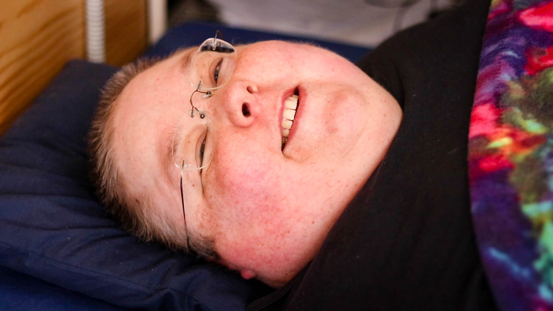 close up of woman's face whilst she'd lying down