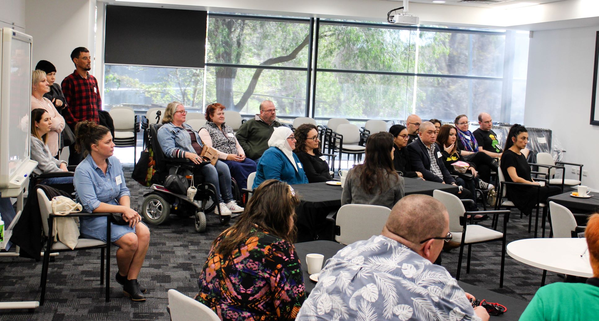 group of people watch a presentation