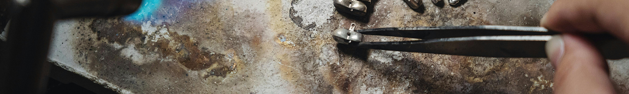 an image of someone doing detailed metal work