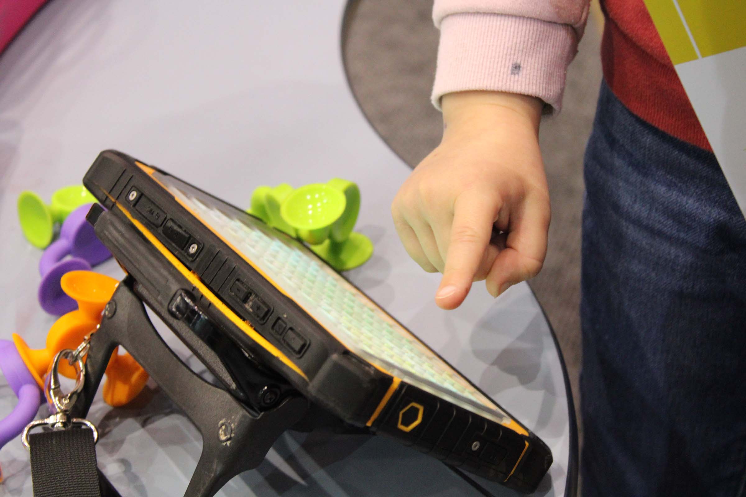 A little hand points to an AAC screen. A little hand points to an AAC screen.