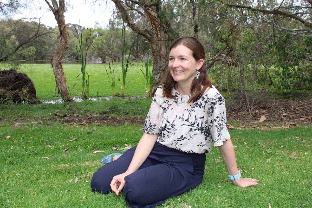 A lady sits in the garden and smiles A lady sits in the garden and smiles