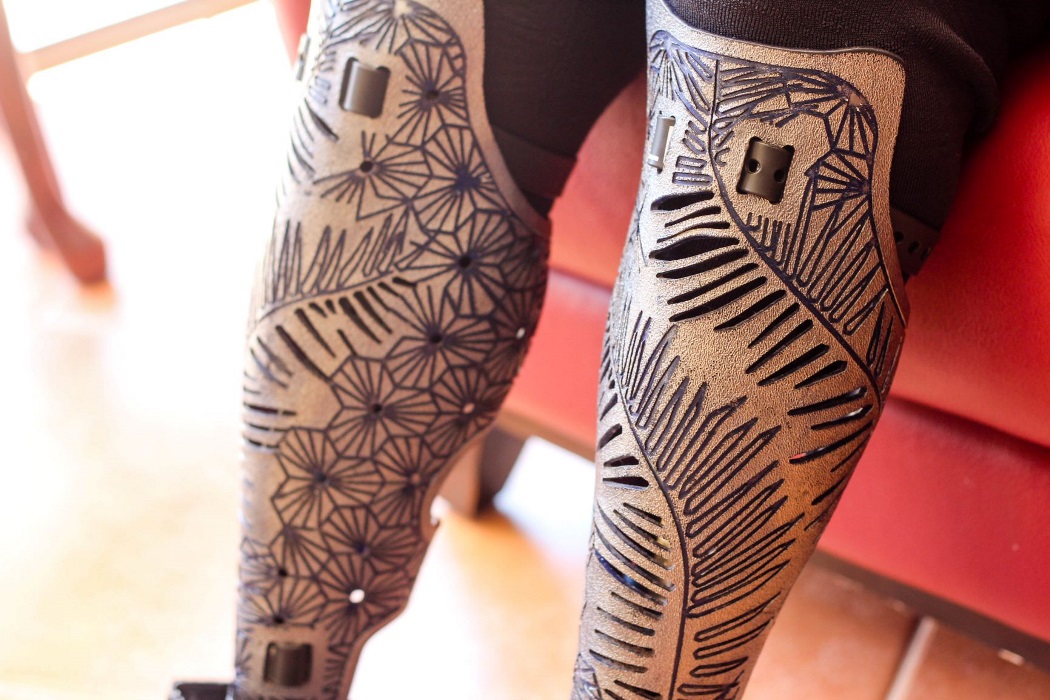 lisa-3 close up of two beautifully patterned leg prosthetics