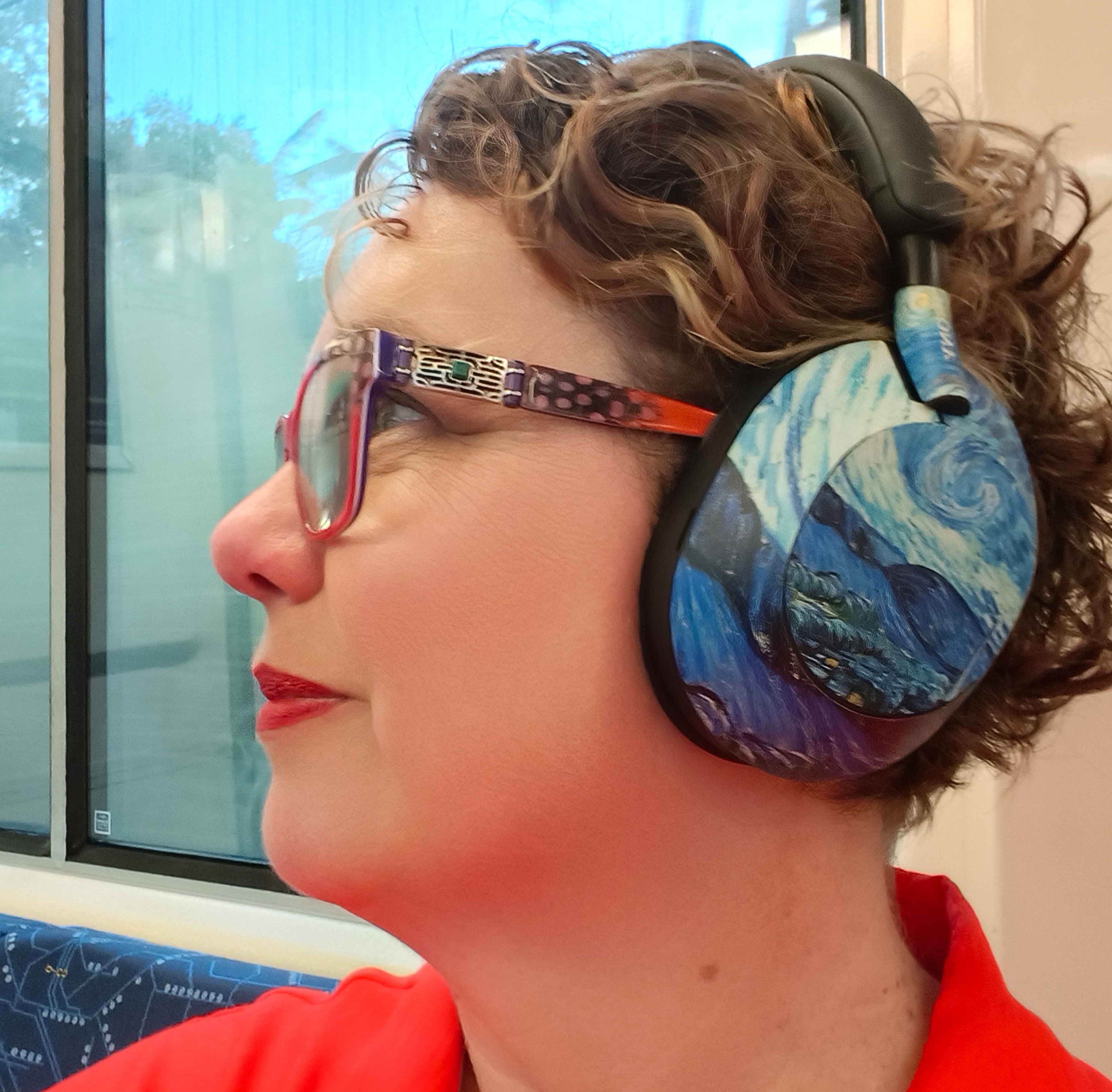 A woman wearing noise cancelling headphones