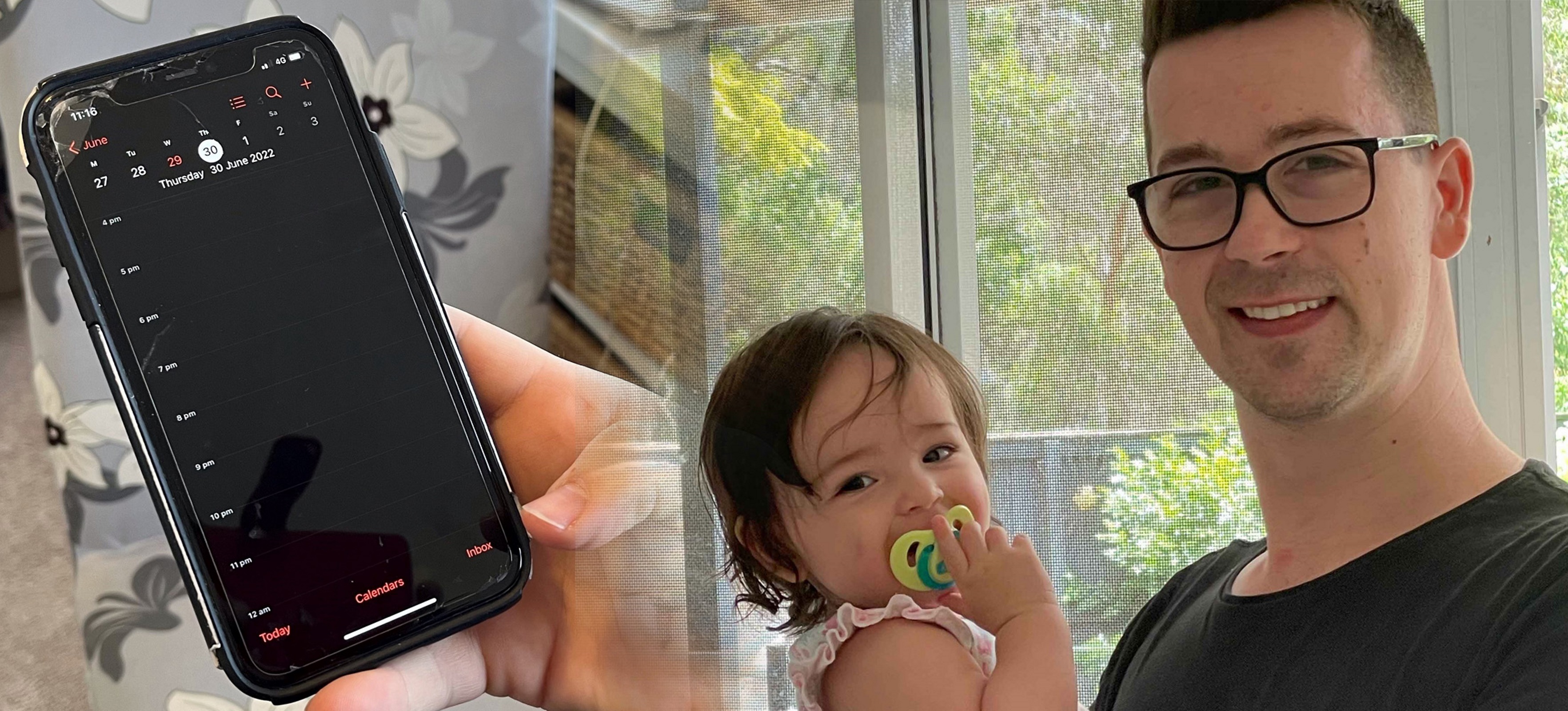 A man is holding his young daughter in his arms as they both smile at the camera. To the side is a hand holding a mobile phone showing a calendar on the screen.