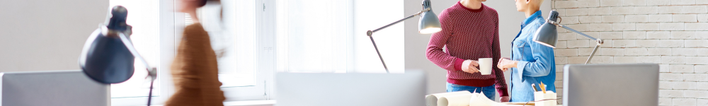 photo of people standing in a brightly lit room